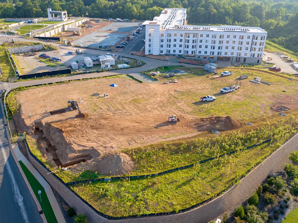 SCI moves dirt on Hampton Inn hotel site at MOSAIC in Pittsboro