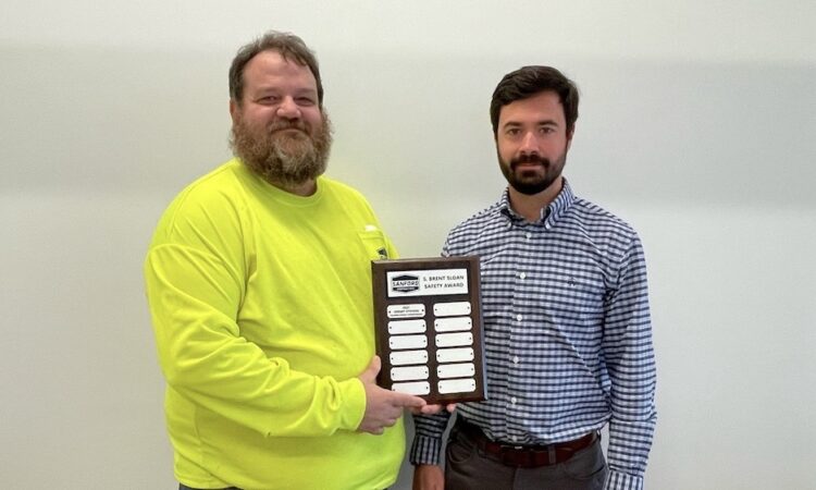 Jeremy Stevens and Rob Brisley pose with the Brent Sloan Safety Award.