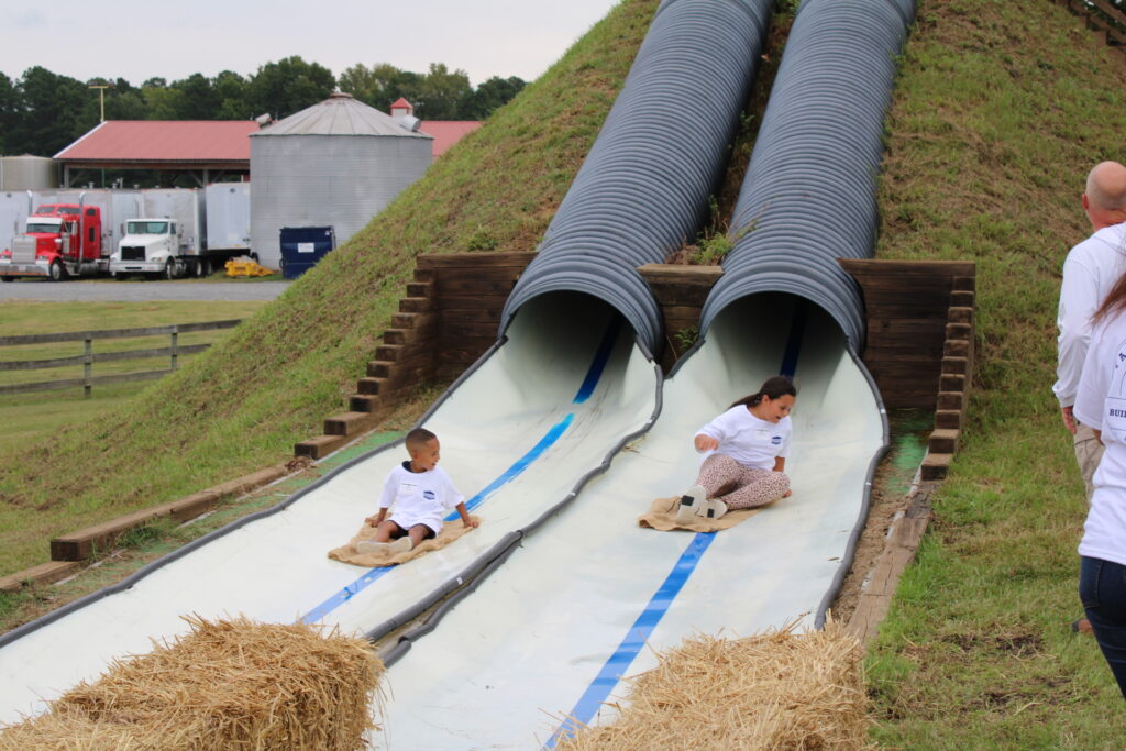 Kids enjoying the slide attraction at Gross Farms